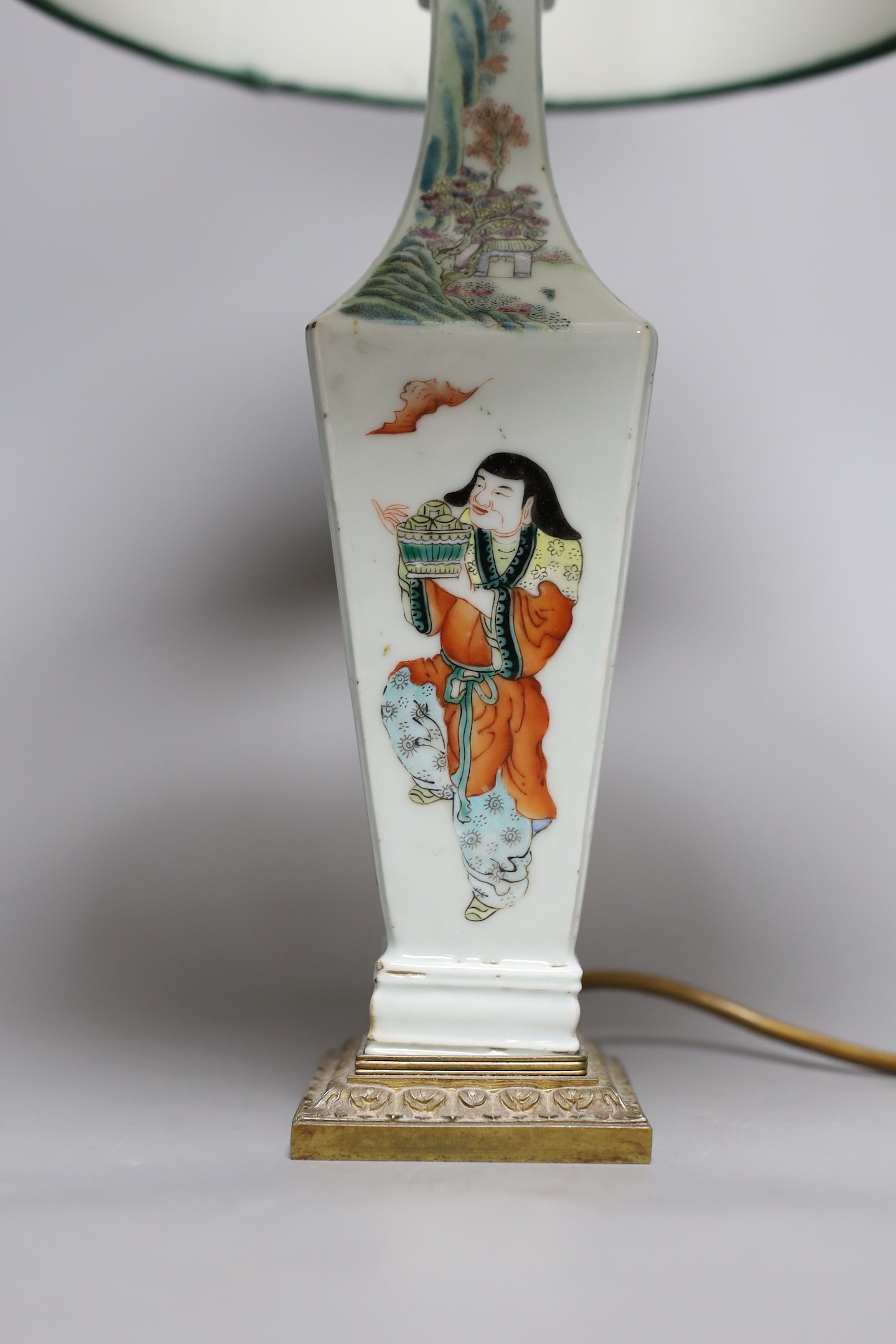 A Chinese famille rose ‘Liu Hai’ vase, late 19th century, with gilt mounts, drilled and converted to a lamp, 28 cms high